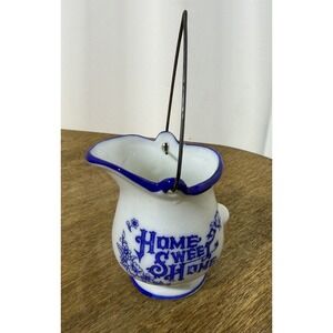 Vintage Home Sweet Home blue and white ceramic mini pitcher with handle.